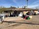 Backyard with a patio, laundry machines, and cluttered with various items at 9804 N 5Th Ave, Phoenix, AZ 85021