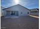Exterior home backyard showcasing a covered patio and spacious yard at 10039 S 23Rd Dr, Phoenix, AZ 85041