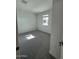 Well-lit bedroom with carpet flooring and a window offering outdoor views at 10039 S 23Rd Dr, Phoenix, AZ 85041