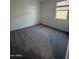 Cozy bedroom featuring neutral carpet and a window allowing for natural light at 10039 S 23Rd Dr, Phoenix, AZ 85041
