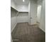 Bright walk-in closet with rod and shelf storage, and neutral carpeting for a clean, organized space at 10039 S 23Rd Dr, Phoenix, AZ 85041