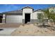 Charming single-story home featuring neutral colors, a two-car garage, and low maintenance front yard at 10039 S 23Rd Dr, Phoenix, AZ 85041