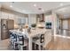 Modern kitchen with stainless steel appliances, a large kitchen island, and bar stool seating at 10039 S 23Rd Dr, Phoenix, AZ 85041