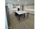 Spacious kitchen featuring modern appliances, large island and adjacent living space at 10039 S 23Rd Dr, Phoenix, AZ 85041