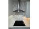Modern kitchen features stainless steel range hood, sleek countertops, and stylish backsplash at 10039 S 23Rd Dr, Phoenix, AZ 85041