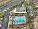 Aerial view of community amenities, including a pool, splashpad, and green spaces at 10249 E Kinetic Dr, Mesa, AZ 85212