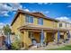 Exterior of home featuring outdoor patio, lush landscaping, and a well-manicured lawn at 10249 E Kinetic Dr, Mesa, AZ 85212