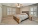 Bedroom with carpet, ceiling fan, and plantation shutters at 10249 E Kinetic Dr, Mesa, AZ 85212