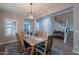 Formal dining room featuring a wooden table, six chairs, and decorative light fixture at 10249 E Kinetic Dr, Mesa, AZ 85212