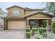 Charming two-story home with a well-manicured lawn and a two-car garage at 10249 E Kinetic Dr, Mesa, AZ 85212