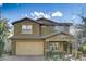 Charming two-story home featuring neutral-toned stucco and tile roof, with a 2-car garage and tidy landscaping at 10249 E Kinetic Dr, Mesa, AZ 85212