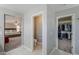 Hallway leading to the main bedroom, walk-in closet, and private toilet room at 10249 E Kinetic Dr, Mesa, AZ 85212