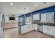 Inviting kitchen connects to living room, featuring an island, stainless appliances, and a seamless flow at 10249 E Kinetic Dr, Mesa, AZ 85212