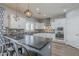 Modern kitchen with granite countertops, stainless steel appliances and decorative pendant lights at 10249 E Kinetic Dr, Mesa, AZ 85212