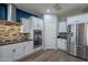 Bright kitchen featuring stainless steel appliances, granite counters, and mosaic tile backsplash at 10249 E Kinetic Dr, Mesa, AZ 85212