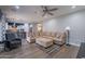 Open living room featuring a sectional sofa that adjoins the kitchen at 10249 E Kinetic Dr, Mesa, AZ 85212