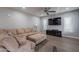 Spacious living room with a large sectional sofa and modern decor at 10249 E Kinetic Dr, Mesa, AZ 85212