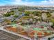 View of a neighborhood playground surrounded by walking path with community in the distance at 10249 E Kinetic Dr, Mesa, AZ 85212