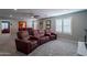 Home theater room featuring leather seating, a ceiling fan, and wall art at 10249 E Kinetic Dr, Mesa, AZ 85212