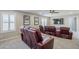 Theater room with leather recliners, movie-themed decor, and a ceiling fan at 10249 E Kinetic Dr, Mesa, AZ 85212