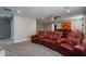 Home theater room with plush leather seating and a view of the hallway at 10249 E Kinetic Dr, Mesa, AZ 85212