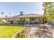 Serene backyard features artificial grass, pavers, and inviting outdoor seating at 10410 E San Tan Blvd, Sun Lakes, AZ 85248