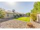 Spacious backyard with rock landscaping and lush artificial turf at 10410 E San Tan Blvd, Sun Lakes, AZ 85248