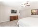 Bedroom featuring a ceiling fan, dresser, and a plush carpet at 10410 E San Tan Blvd, Sun Lakes, AZ 85248