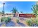 Elegant community entrance sign surrounded by desert landscaping and mature trees at 10410 E San Tan Blvd, Sun Lakes, AZ 85248