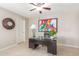 Cozy home office featuring neutral walls and a sleek glass-topped desk at 10410 E San Tan Blvd, Sun Lakes, AZ 85248