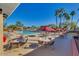 Inviting community pool with lounge chairs, tables, and umbrellas for a relaxing day at 10410 E San Tan Blvd, Sun Lakes, AZ 85248