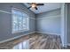 Bright bedroom featuring vaulted ceiling, neutral walls, and shuttered window at 1086 S Western Skies Dr, Gilbert, AZ 85296