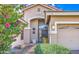 Inviting front entrance with a well-maintained lawn, desert landscaping, and a charming front door at 1086 S Western Skies Dr, Gilbert, AZ 85296