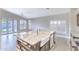 Kitchen island featuring granite countertops, a farmhouse sink, and stainless steel appliances at 1086 S Western Skies Dr, Gilbert, AZ 85296