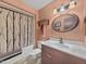 Cozy bathroom with decorative light fixture, and a combined shower and bathtub at 10906 W Thunderbird Blvd, Sun City, AZ 85351