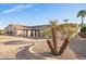 Charming single-story home with desert landscaping, mature desert plants, and a lengthy driveway at 11005 W Crestbrook Dr, Sun City, AZ 85351