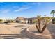 Charming single-story home with desert landscaping, mature desert plants, and a lengthy driveway at 11005 W Crestbrook Dr, Sun City, AZ 85351