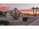 Charming single-story home with gravel landscaping, unique desert plants, and a lush green bush at 11005 W Crestbrook Dr, Sun City, AZ 85351