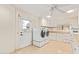 Bright laundry room with updated washer and dryer and ample storage at 11005 W Crestbrook Dr, Sun City, AZ 85351