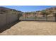 Spacious backyard with potential, featuring desert landscaping and wrought iron perimeter fencing at 1111 E Mcneil St, Phoenix, AZ 85042