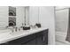 Modern bathroom featuring double sinks with sleek black cabinetry and a large mirror at 1111 E Mcneil St, Phoenix, AZ 85042