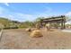 Natural playground with rock features and shade structure, blending recreation with the beautiful landscape at 1111 E Mcneil St, Phoenix, AZ 85044