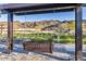 Relaxing porch swing under a pergola offering a peaceful spot to enjoy the views of the surrounding landscape at 1111 E Mcneil St, Phoenix, AZ 85044