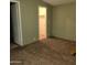 A carpeted bedroom features a closet at 11411 N 91St Ave # 122, Peoria, AZ 85345