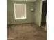 A carpeted bedroom with a window for natural light and built-in lighting fixtures at 11411 N 91St Ave # 122, Peoria, AZ 85345