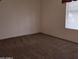 Bedroom featuring neutral carpet, a window with blinds, and a blank canvas at 11411 N 91St Ave # 122, Peoria, AZ 85345