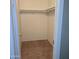 A walk-in closet with shelving and a rod to hang clothes at 11411 N 91St Ave # 122, Peoria, AZ 85345