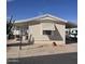 Charming manufactured home featuring an awning and xeriscaped front yard at 11411 N 91St Ave # 122, Peoria, AZ 85345