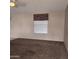 Spacious living room with plush carpet, neutral walls, and a window with custom valance at 11411 N 91St Ave # 122, Peoria, AZ 85345