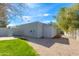 View of the backyard shed with an attached AC and gravel landscaping at 12836 N 60Th St, Scottsdale, AZ 85254